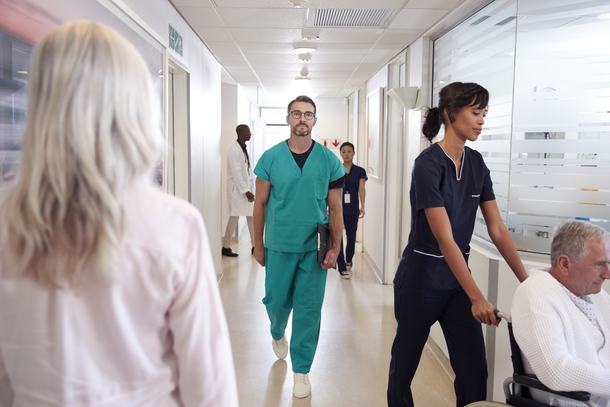 Busy Hospital Corridor With Medical Staff And Patients